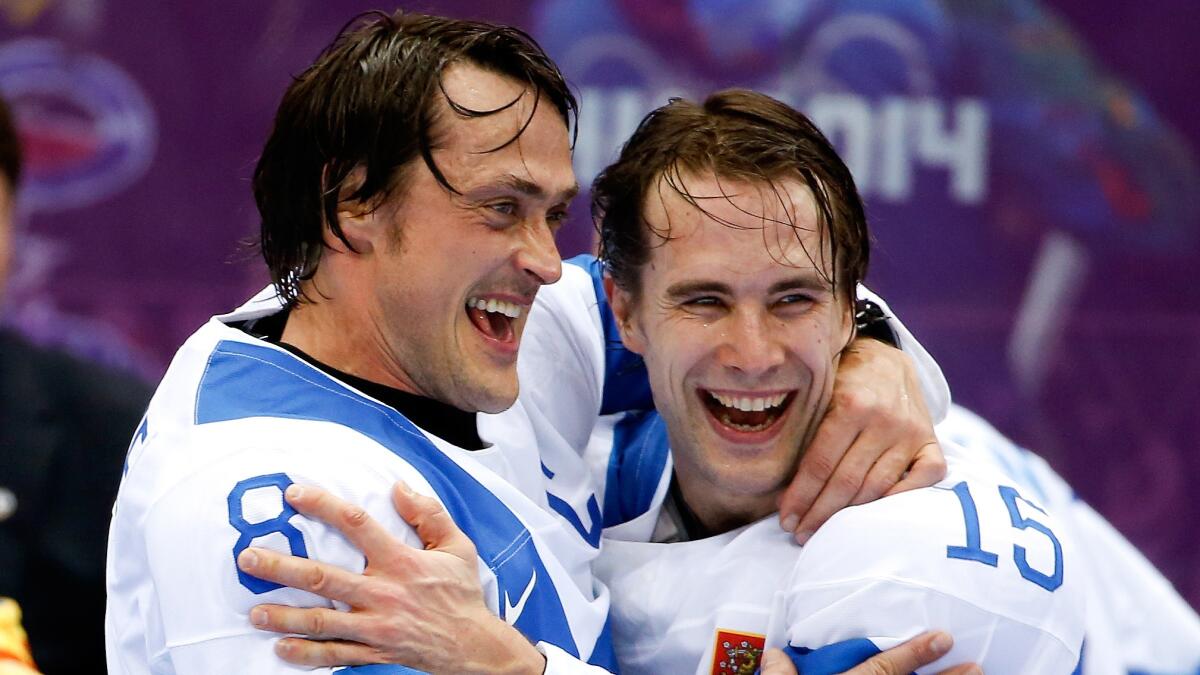 Teemu Selanne, left, and Finland teammate Tuomo Ruutu celebrate the team's bronze medal victory over the U.S. at the Sochi Winter Olympic Games in February.