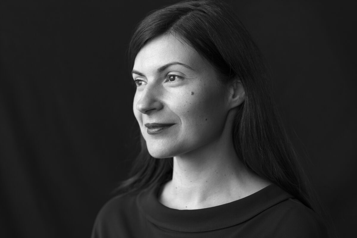 A black-and-white portrait of author Mona Awad.