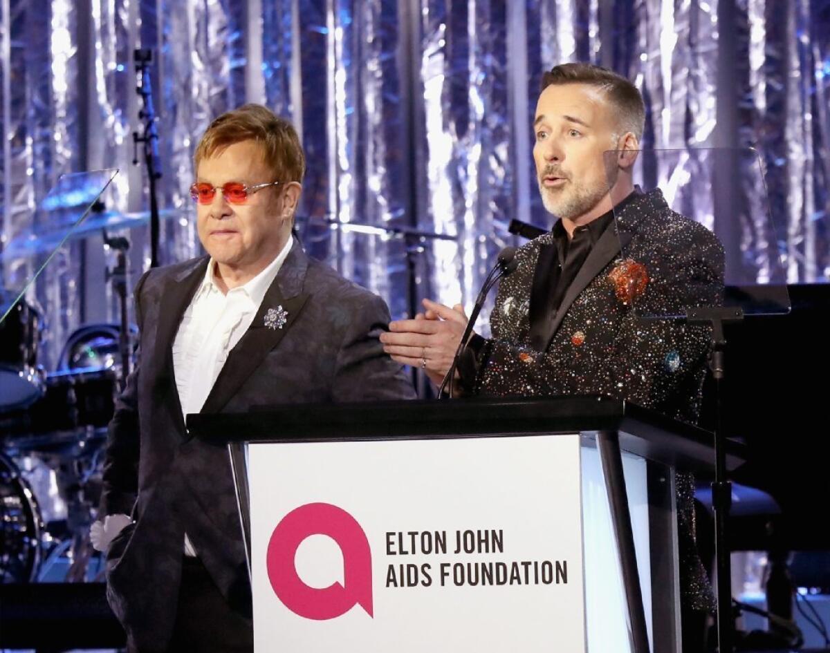 Elton John, left, and David Furnish at the Elton John AIDS Foundation's Academy Awards viewing party on Sunday.