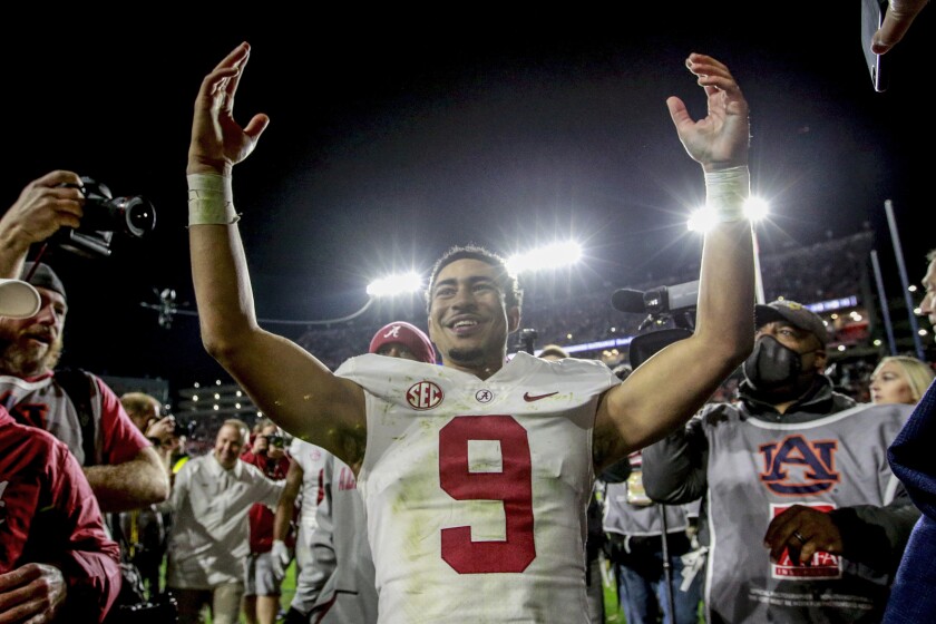 FILE - Alabama quarterback Bryce Young (9) celebrates after Alabama defeated Auburn during the fourth overtime of an NCAA college football game Nov. 27, 2021, in Auburn, Ala. Young has been voted The Associated Press college football player of the year. (AP Photo/Butch Dill, File)