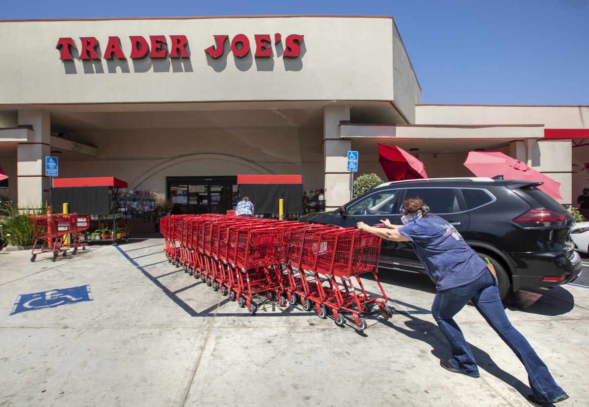 Shopping carts are returned to a collection area outside a Trader Joe's in Sherman Oaks. 