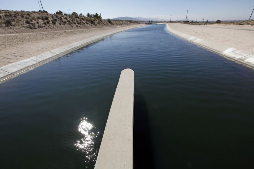 The California Aqueduct is seen as it passes through Palmdale, Calif., in Southern California's Antelope Valley Tuesday, April 10, 2012. (AP Photo/Reed Saxon)