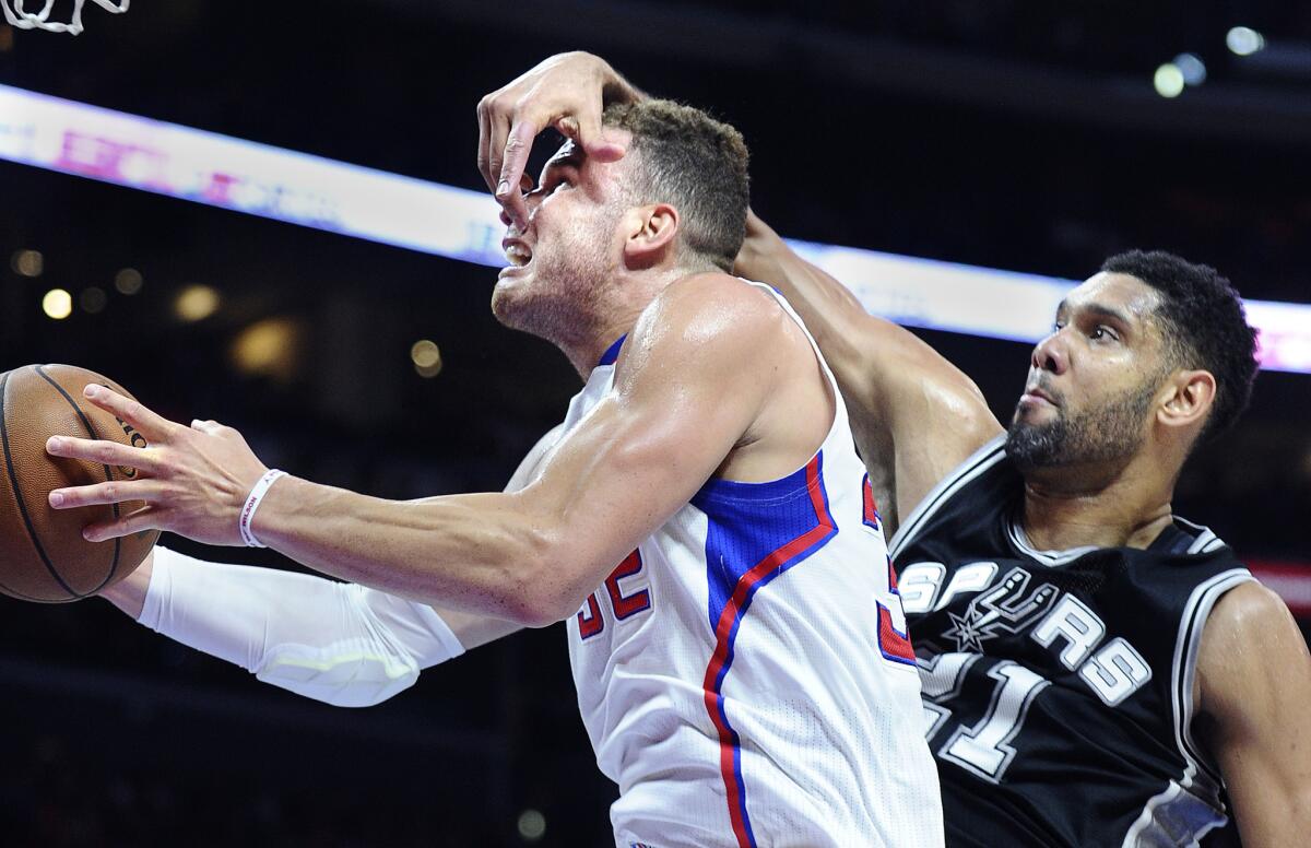 Clippers forward Blake Griffin is struck in the face by Spurs forward Tim Duncan while trying to shoot a layup during Game 1 of their playoff series on April 19.