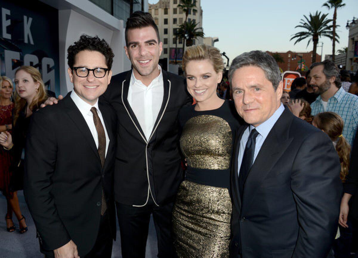 Alice Eve was considerably more covered up at last week's premiere of "Star Trek Into Darkness" than she was in a scene from the film in which she wore lingerie. Posing with her, from left, are director J.J. Abrams, actor Zachary Quinto and Paramount Pictures Chairman Brad Grey.