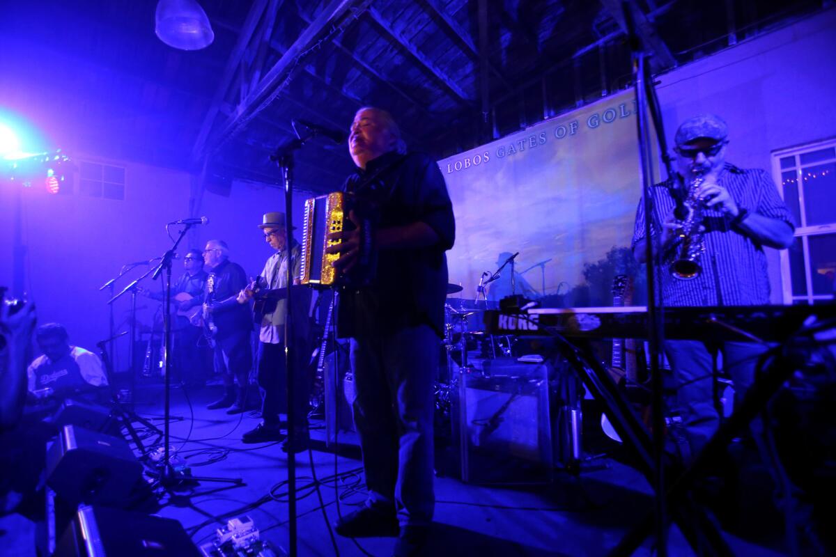 Los Lobos performs an intimate concert for family and friends to celebrate the band's new album, "Gates of Gold," at El Gallo Plaza in East Los Angeles on Sept. 29, 2015.