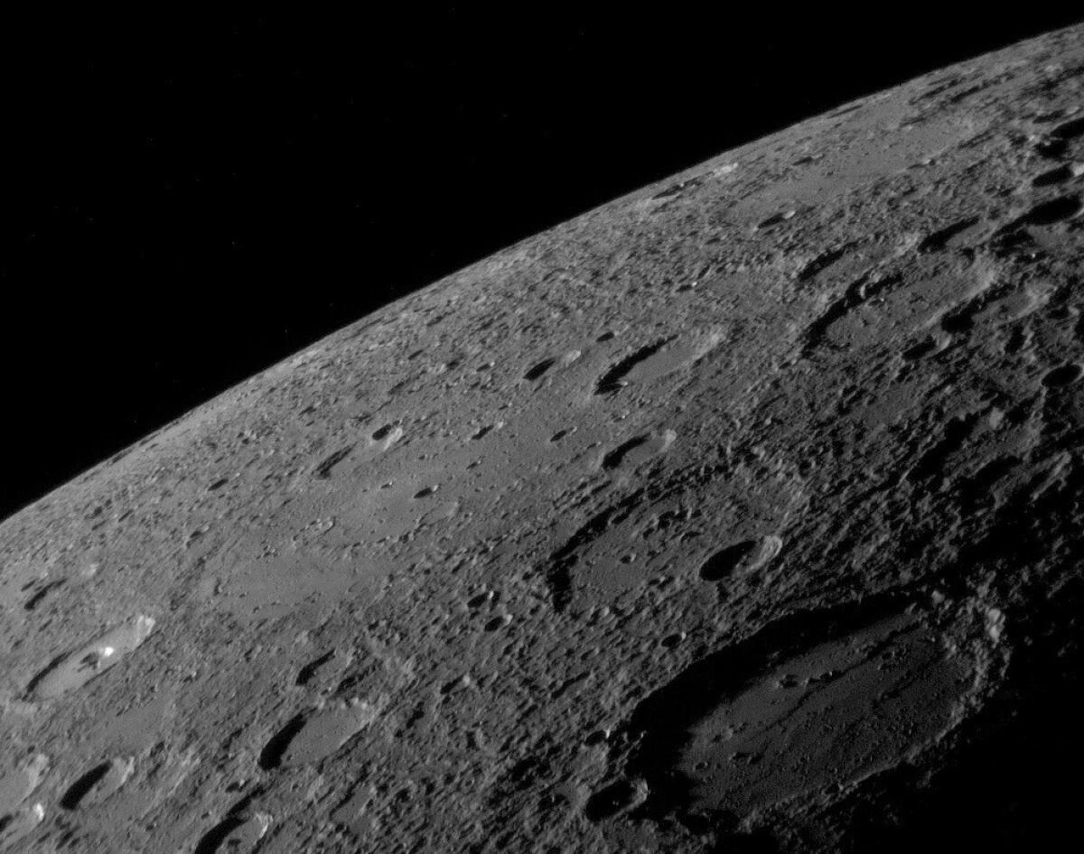 An image from NASA's MESSENGER spacecraft shows a variety of surface textures on Mercury's surface. Scientists have found that the planet has been shrinking, based on deformations in the surface called lobate scarps and wrinkle ridges.