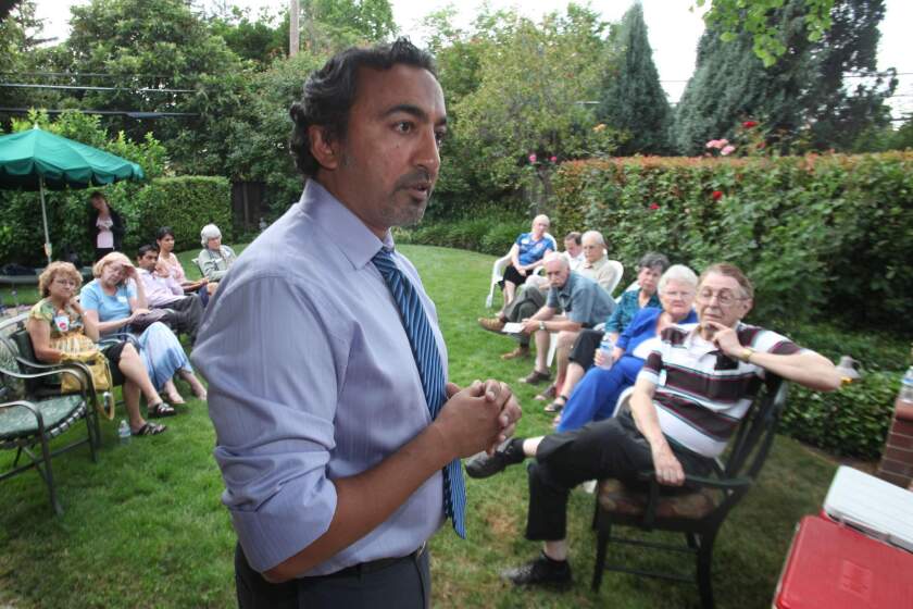 In this 2010 photo, Rep. Ami Bera (D-Elk Grove) addresses supporters at a campaign gathering in Carmichael, Calif. Bera's father has pleaded guility to illegal campaign contributions in 2009 and 2011.