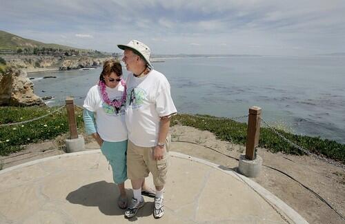 REMEMBRANCE: Stan and Denise Smart at the Kristin Smart Point of Hope in Shell Beach, south of San Luis Obispo, named for their daughter. The Smarts, unhappy with the official investigation, have sought help from psychics, amateur sleuths and tipsters.