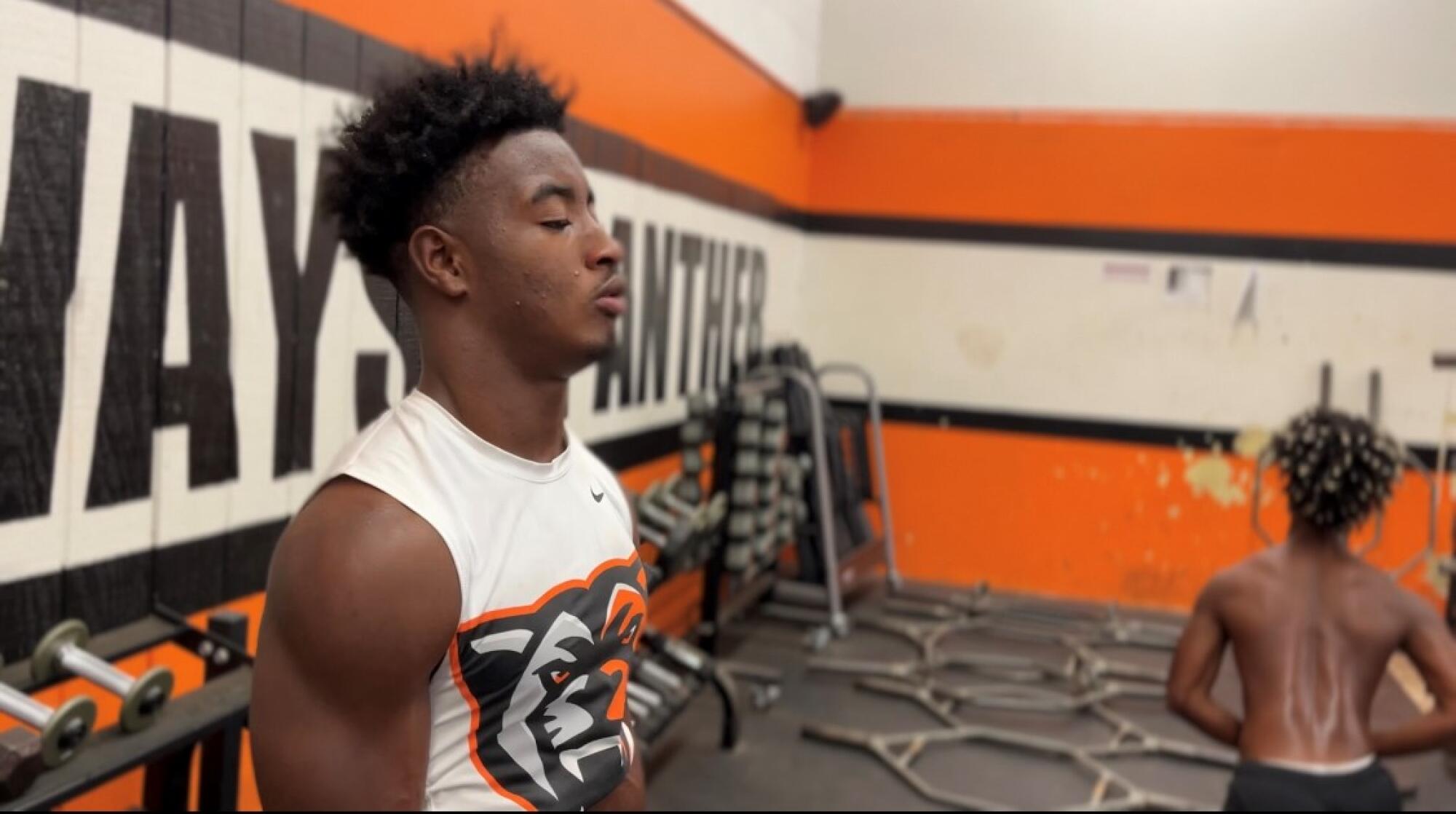 Kobe Boykin catches his breath between repetitions during a weight-lifting session at Orange High.