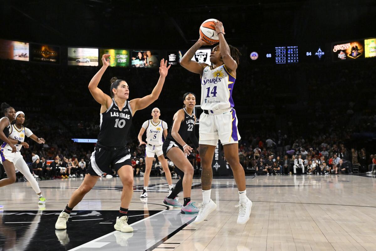 The Sparks’ Crystal Dangerfield pulls up for a jumper against the Aces on Sunday in Las Vegas.