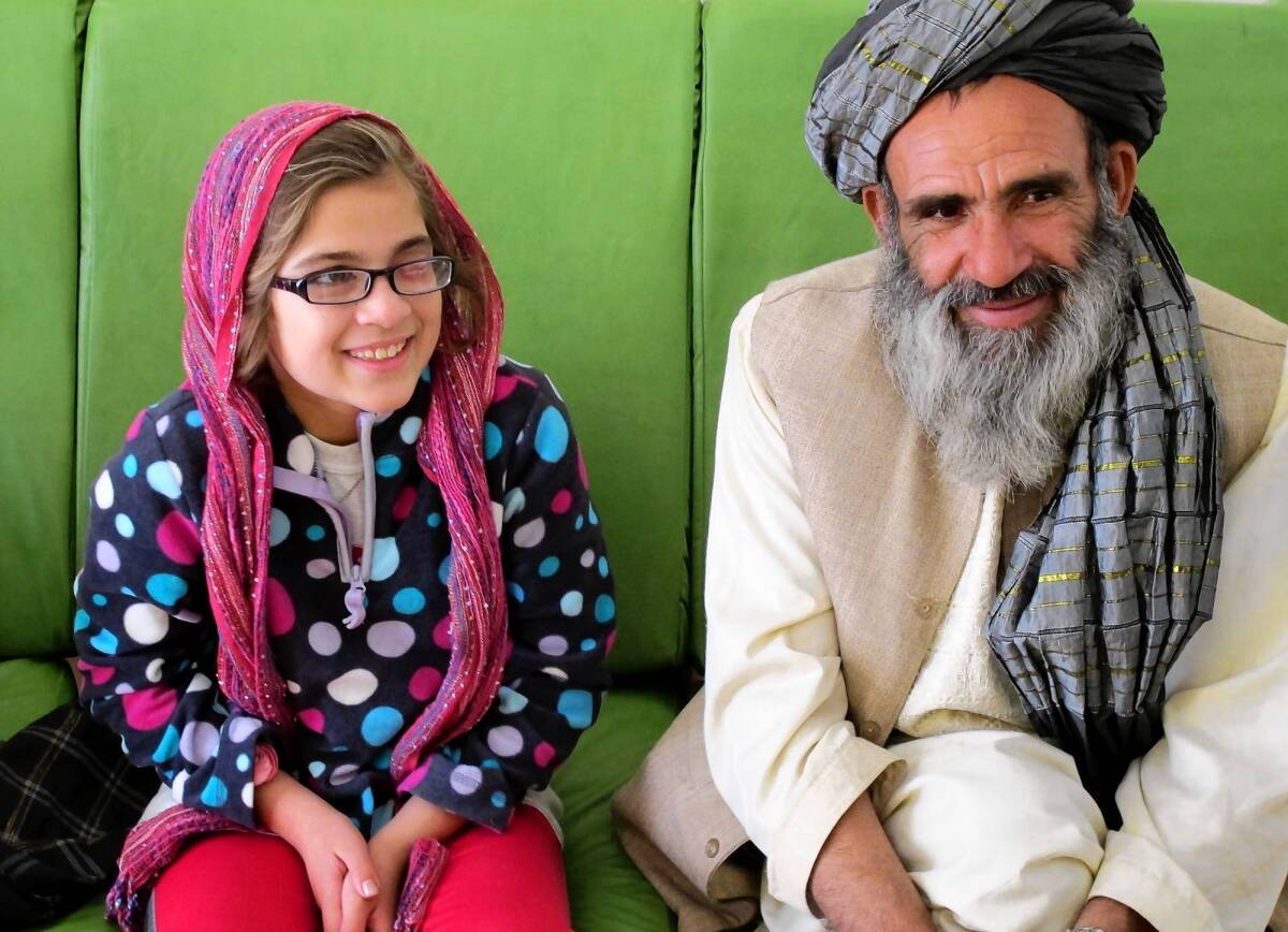 Farida, 11, with her father, Abdul Rauf, who defied the Taliban by allowing her to travel with an American charity to live and get medical care in the U.S.