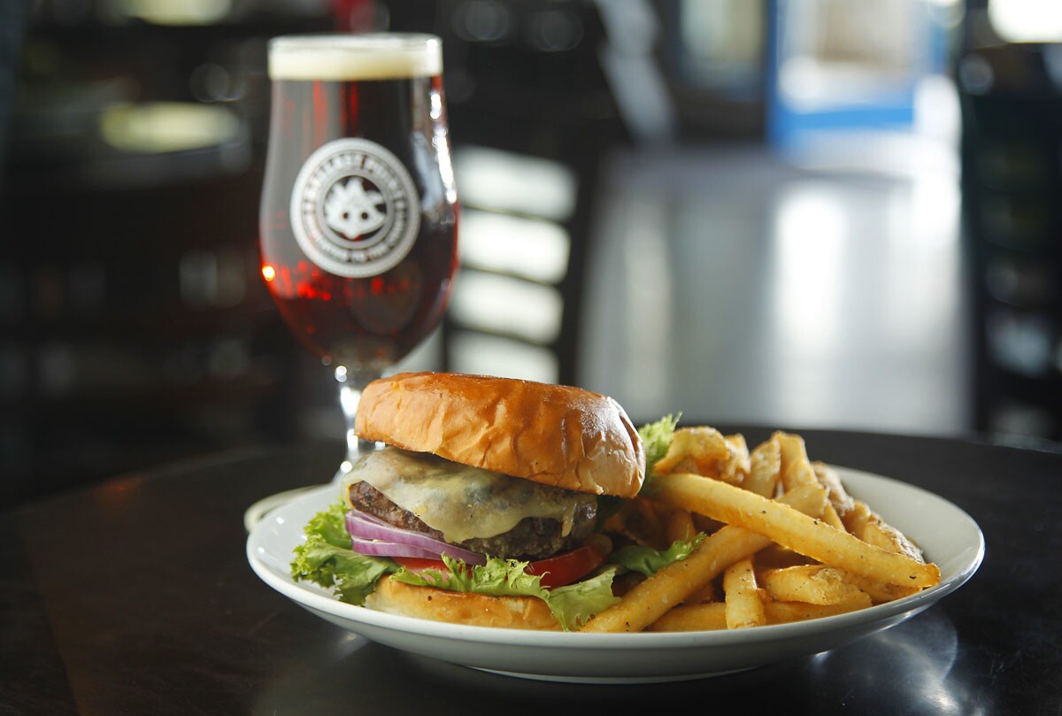 Ballast Point Burger with California Amber at Ballast Point Tasting Room & Kitchen in San Diego's Little Italy. (K.C. Alfred/The San Diego Union-Tribune)