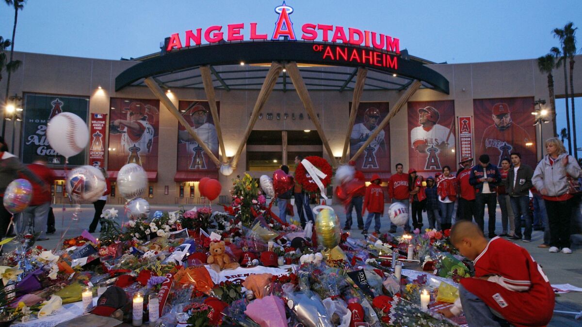 Angels fans pay tribute to pitcher Nick Adenhart outside Angel Stadium on April 9, 2009.