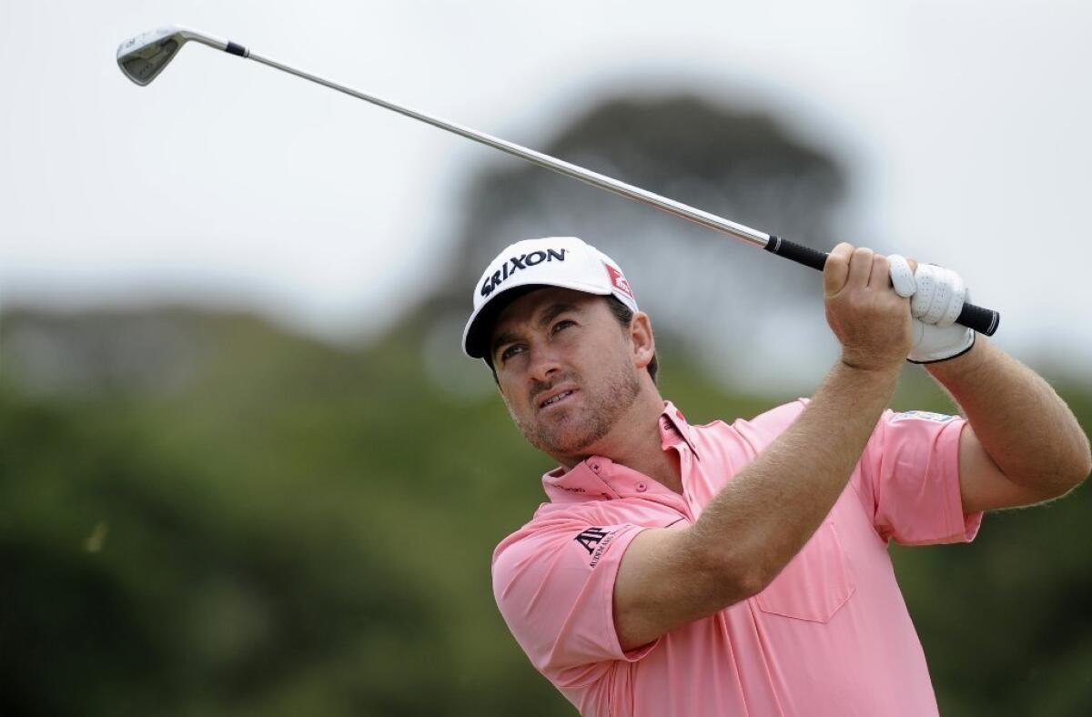 Graeme McDowell hits an approach shot at the World Cup of Golf in Australia.