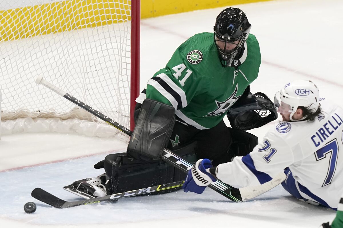 Dallas Stars goaltender Scott Wedgewood (41) defends the goal against Tampa Bay Lightning center Anthony Cirelli (71) during the second period of an NHL hockey game in Dallas, Tuesday, April 12, 2022. (AP Photo/LM Otero)