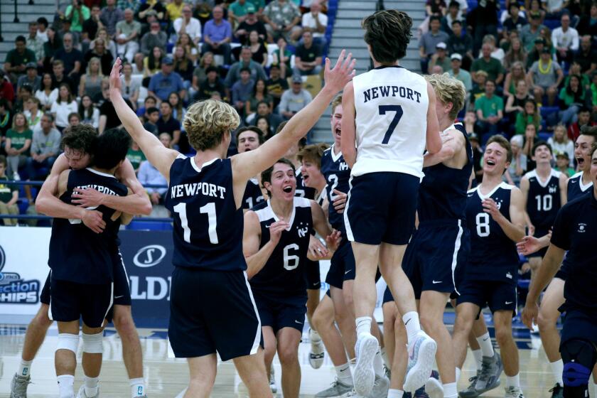 Newport Harbor High School players celebrate winning the CIF-SS BoysÕ Volleyball Division 1 Championship match vs. Manhattan Beach Mira Costa, at Cerritos College in Norwalk on Saturday, May 11, 2019. Newport Harbor won 3-1.