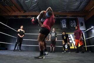 La Mesa, California - June 23: Students practice moves and and techniques on the ring supervised by head coach Benny Cuntapay (B-Boy). In the center Aaron Hopkins tosses a student over his back at Level Up Pro Wrestling School on Wednesday, June 23, 2021 in La Mesa, California (Alejandro Tamayo / The San Diego Union-Tribune)