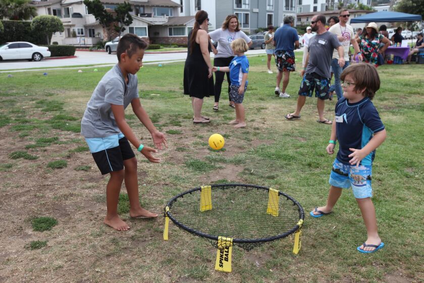 Malachi Minjares and Jake Adams play spikeball during a beach day for Camp Cosmos on July 31 in La Jolla Shores.