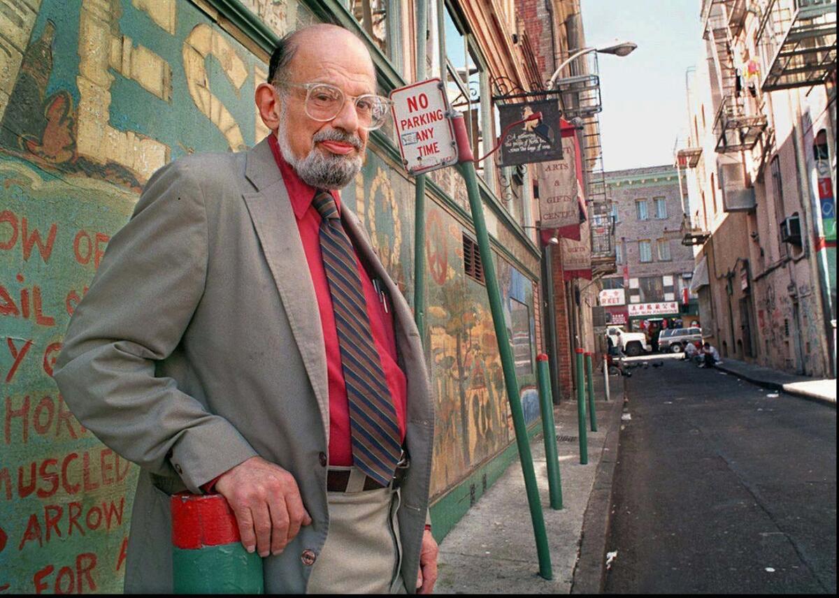 Poet Allen Ginsberg stands in Jack Kerouac Alley next to City Lights Bookstore in San Francisco's North Beach district in September 1994.