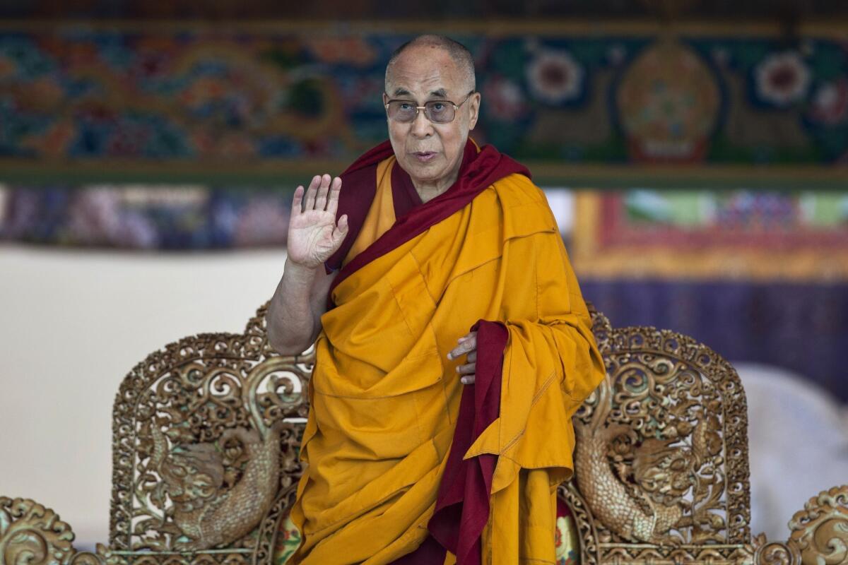 Tibetan spiritual leader the Dalai Lama, shown July 7 near Leh, India, was a target of critical fake tweets. Dozens of fake Twitter accounts were suspended Tuesday after being outed by Free Tibet, an advocacy group.