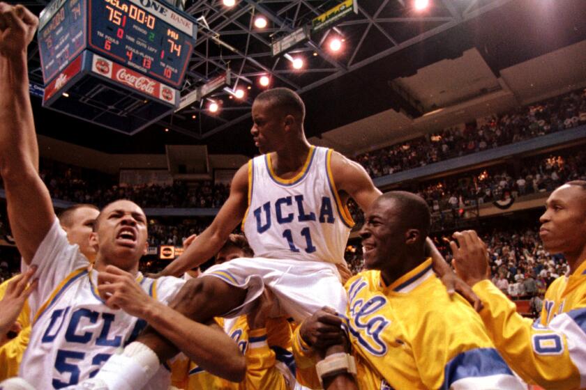 UCLA teammates give guard Tyus Edney a ride on their shoulders after he made the game-winning shot to beat Missouri, 75-74, in the NCAA West Regional on March 19, 1995.