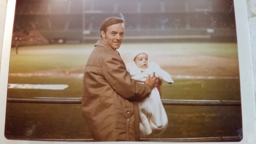 Howard Frank takes his son Gary, then 7 months old, to his first baseball game.