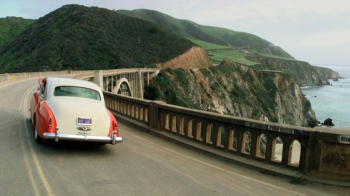 A 1959 Rolls Royce driven by Doug Effrom of Monterey, Calif., crosses the Bixby Bridge on California Highway 1 near Big Sur on April 30, 1998.