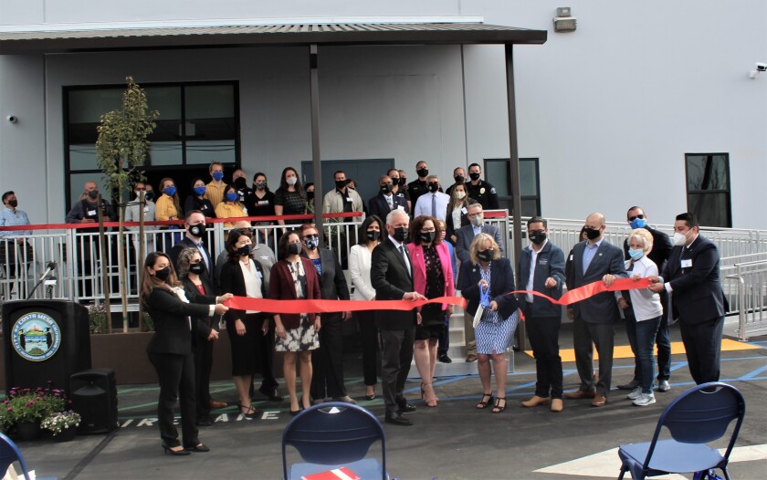 Costa Mesa city officials in a ribbon-cutting ceremony Tuesday for a homeless shelter on Airway Avenue.