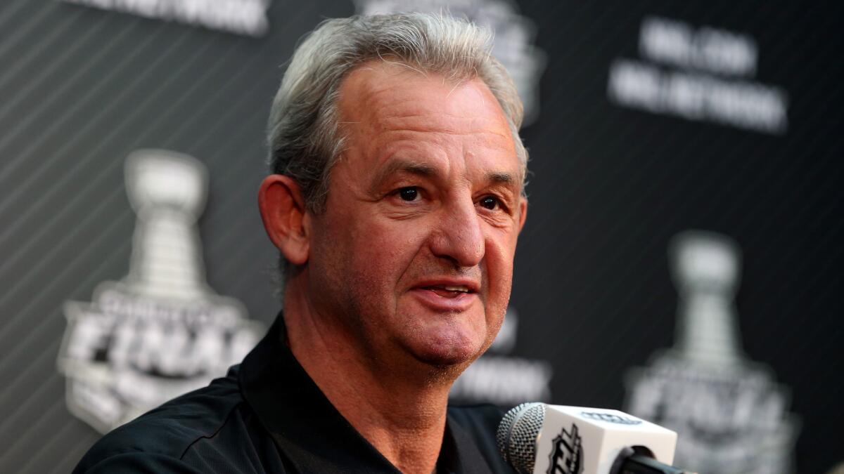 Kings Coach Darryl Sutter speaks during a news conference at Staples Center on Tuesday. Sutter has guided the Kings to within four wins of capturing their second Stanley Cup in three seasons.