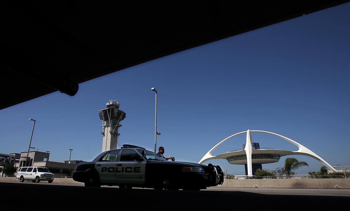 A Los Angeles Airport Police Department officer parks his patrol car outside Terminal 6. The family of a Transportation Security Administration officer slain in a shooting at LAX has filed a claim against the city, alleging the wrongful death of Gerardo Hernandez and seeking damages in excess of $25 million.