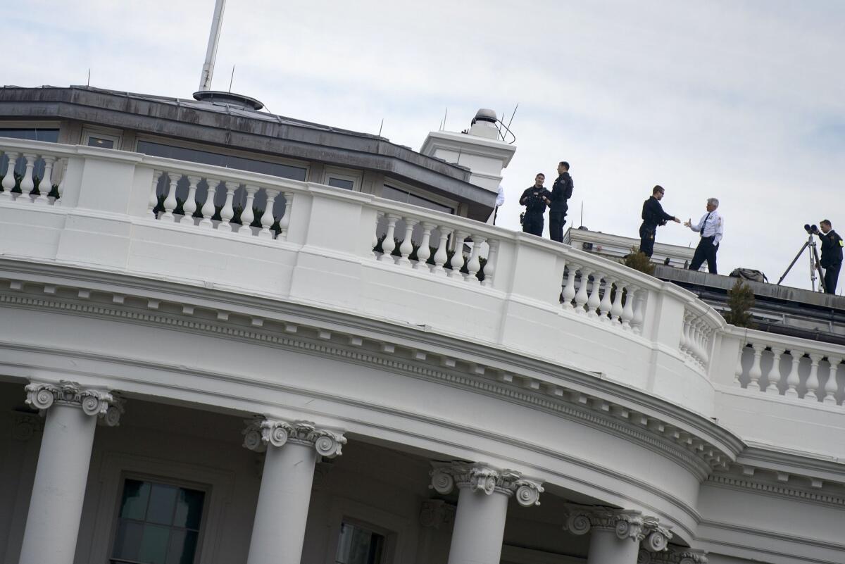 Members of the Secret Service on the roof of the White House on Tuesday.