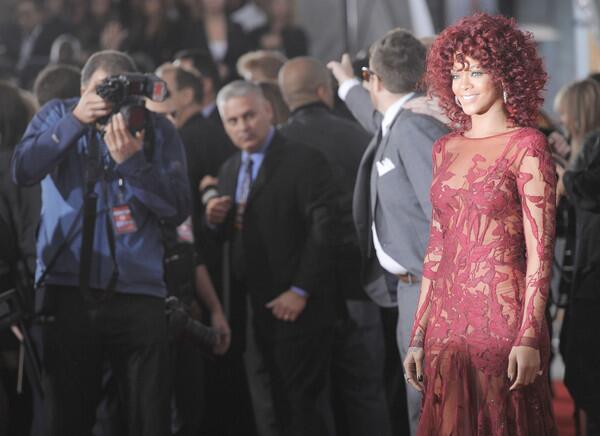 Rihanna poses at show