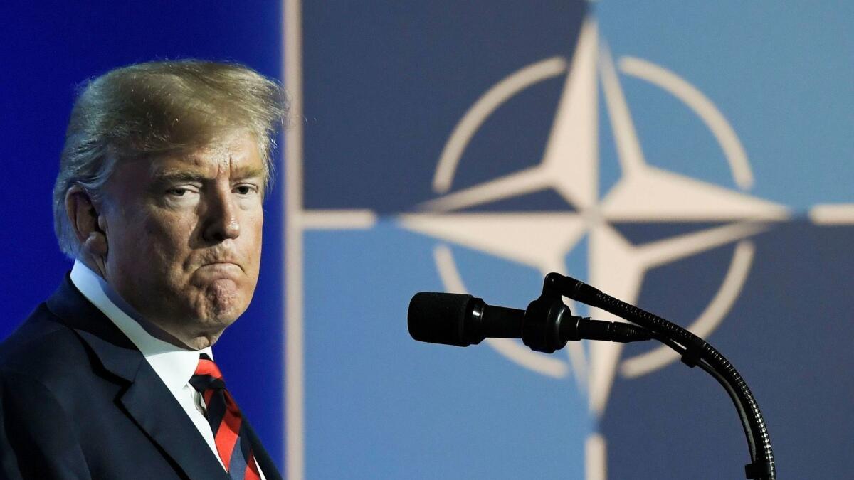 President Trump speaks during a news conference at the NATO summit in Belgium on Thursday.