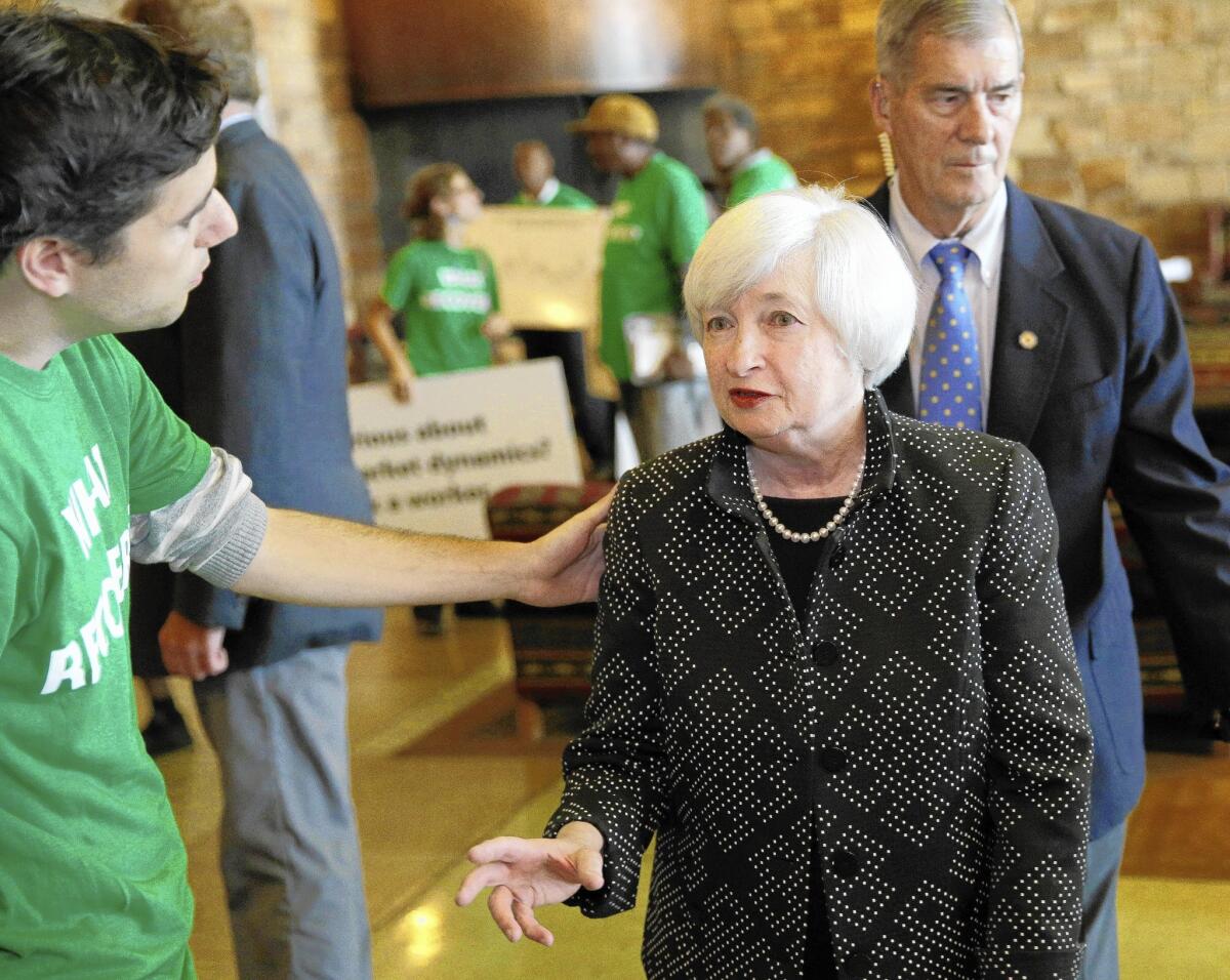 Federal Reserve Chairwoman Janet Yellen speaks with Ady Barkan of the Center for Popular Democracy at an event in Jackson Hole, Wyo.
