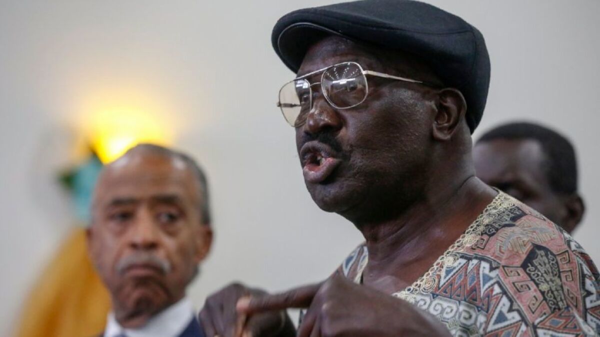 Richard Olango, whose son was killed by El Cajon police in September, spoke at a South Los Angeles news conference in October. Olango filed a lawsuit against police on Tuesday.