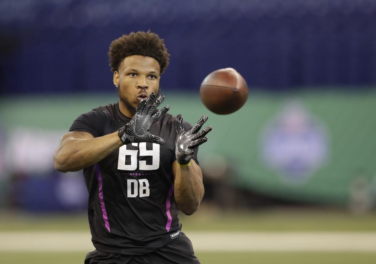 Kyzir White runs a drill during the NFL scouting combine.