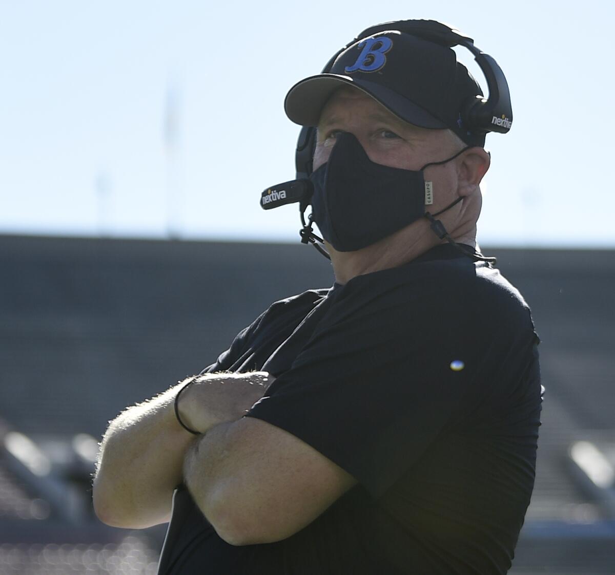 UCLA coach Chip Kelly stands on the sidelines during the Bruins' game against California.