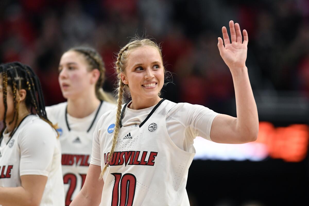 FILE - Louisville guard Hailey Van Lith (10) waves to the crowd at the end of a women's NCAA tournament college basketball second-round game against Gonzaga in Louisville, Ky., Sunday, March 20, 2022. Some star women’s players have already decided to stay in school rather than make their earliest possible jump to the WNBA and more are on the way with NIL deals and chartered travel offering appeal compared to rookie salaries and commercial flights in the WNBA. (AP Photo/Timothy D. Easley, File)