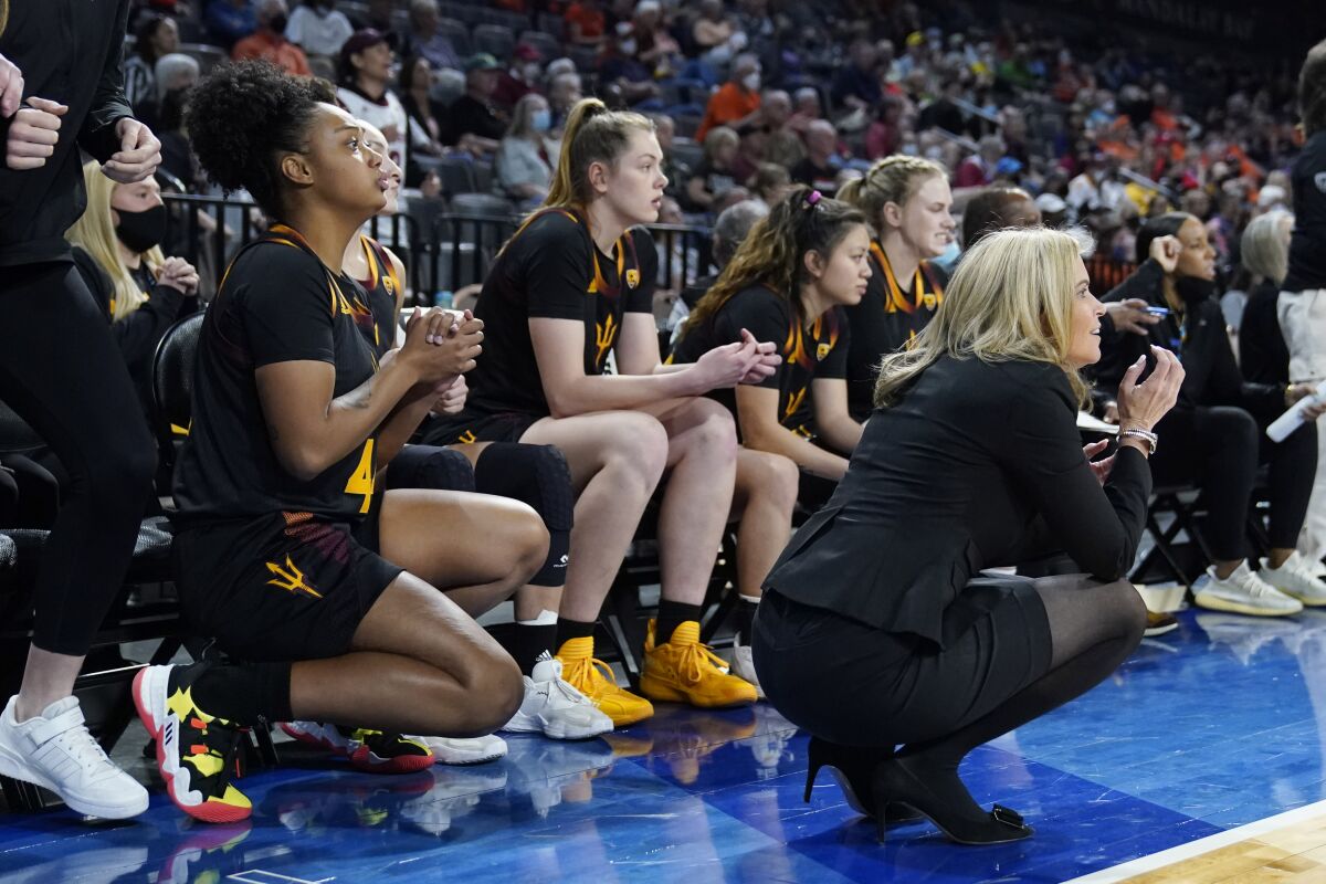 Arizona State head coach Charli Turner Thorne, right, reacts with her team during the second half of an NCAA college basketball game against the Oregon State in the first round of the Pac-12 women's tournament Wednesday, March 2, 2022, in Las Vegas. (AP Photo/John Locher)