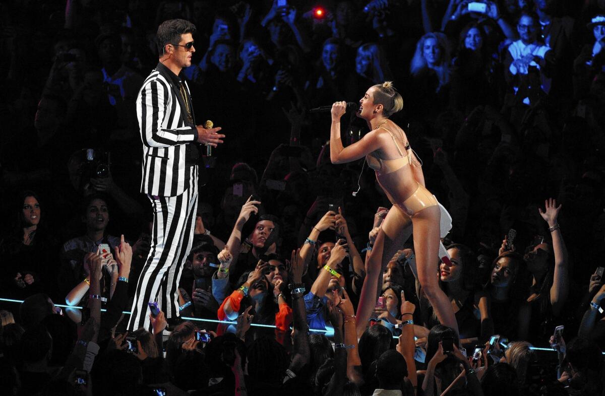 Robin Thicke and Miley Cyrus perform "Blurred Lines" at the MTV Video Music Awards in August.