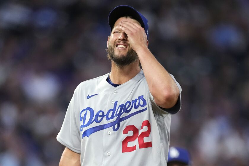 Los Angeles Dodgers starting pitcher Clayton Kershaw waits to be pulled from the mound.