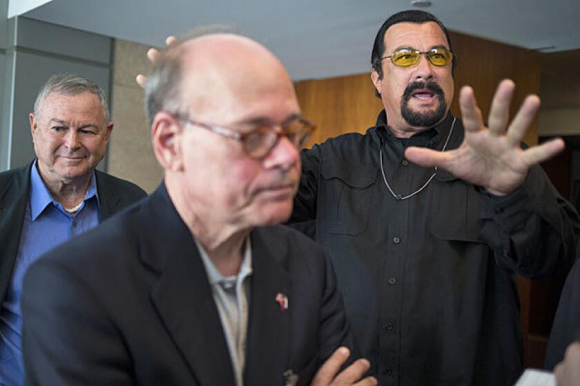 U.S. Reps. Dana Rohrabacher, left, and Steven Cohen with actor Steven Seagal in Moscow.
