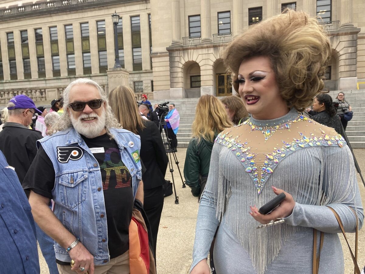 FILE - Drag performer Poly Tics, right, attends a rally in Frankfort, Ky., Thursday, March 2, 2023. Republican lawmakers in Kentucky advanced a bill Friday, March 10, 2023, to put limits on drag shows, capping a free-wielding Senate debate as supporters touted it as a child-protection measure and opponents called it an unconstitutional attack aimed at LGTBQ groups. (AP Photo/Bruce Schreiner, File)