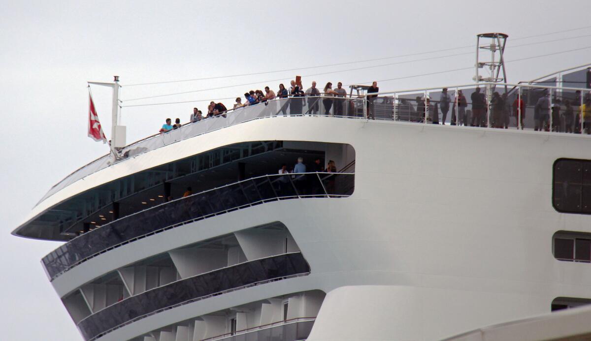 Passengers remain aboard the Meraviglia cruise ship in Cozumel, Mexico, on Feb. 27.