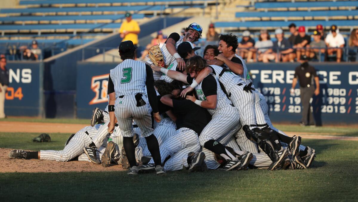 Thousand Oaks baseball players celebrate their win over Trabuco Hills in the Southern Section Division 2 championship game.