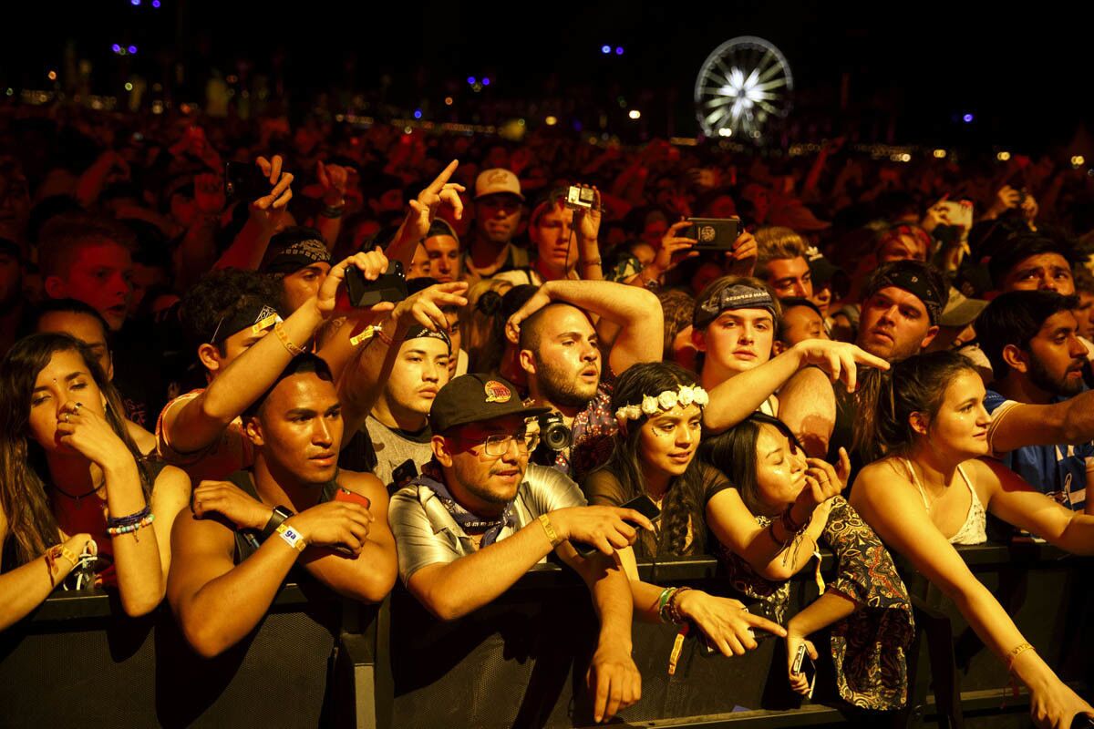 People watch as Hip-hop artist Kendrick Lamar performs during weekend one of the three-day Coachella Valley Music and Arts Festival at the Empire Polo Grounds on Sunday, April 16, 2017 in Indio, Calif. (Patrick T. Fallon/ For The Los Angeles Times)