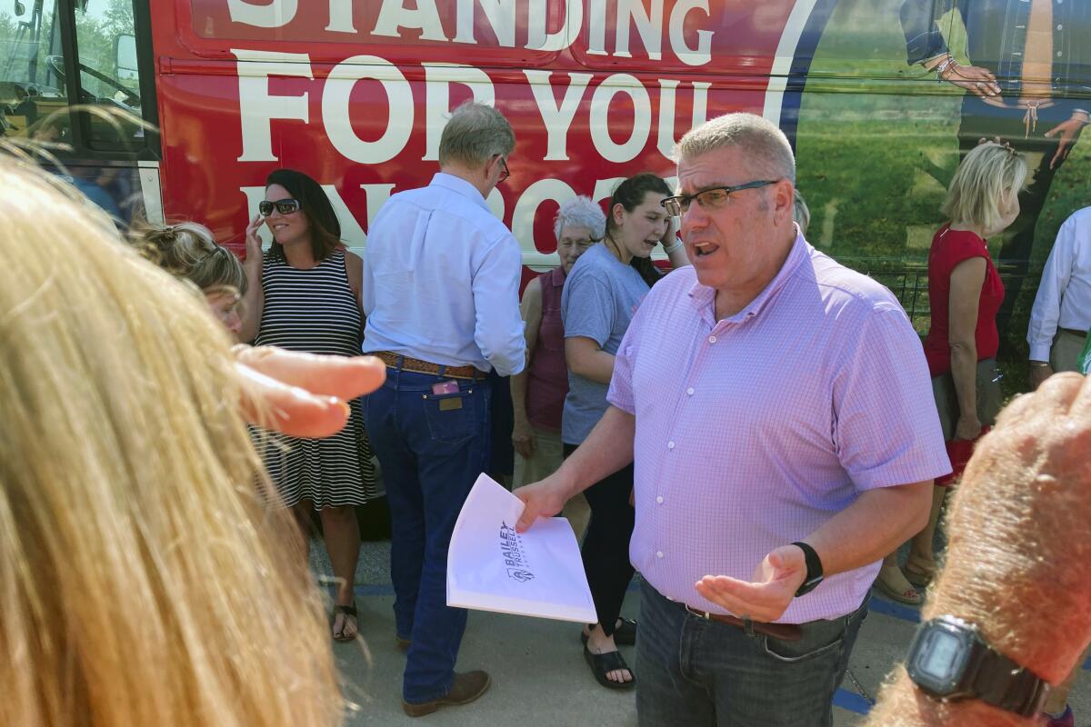 Republican candidate for Illinois governor Darren Bailey speaks to voters during a campaign stop.