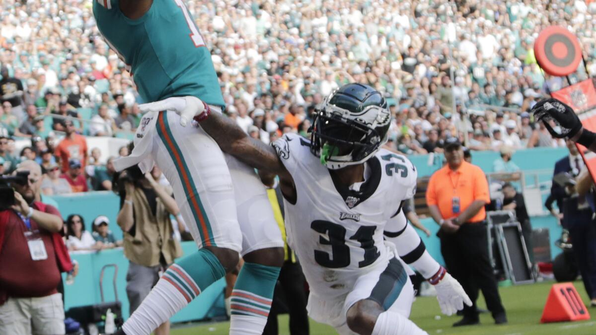 Bag of tricks helps Dolphins rally past Eagles 37-31