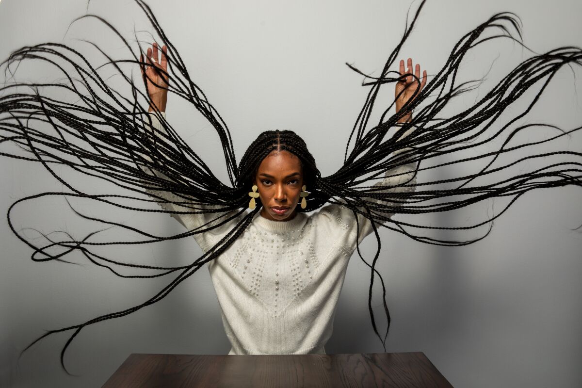 Elle Lorraine, star of “Bad Hair,” with long braids fanned out, at the Sundance Film Festival on Jan. 24, 2020.