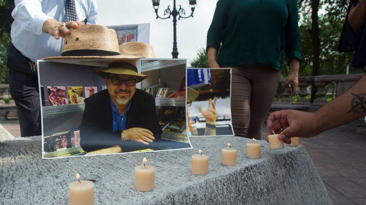A sidewalk memorial Monday in Nuevo Leon state pays tribute to Mexican journalist Javier Valdez on the first anniversary of his slaying. On Tuesday, yet another journalist, Juan Carlos Huerta, was killed in Mexico.